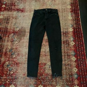 Hudson brand faded black jeans with raw hem and holey detail at knee. Size 29